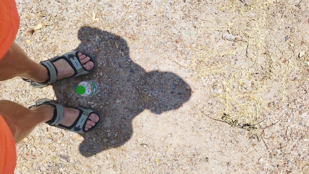 Schatten vor Buddha Statue